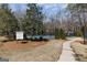 Community tennis courts with well maintained landscaping, path and signage at 2032 Stonewick Ct, Lawrenceville, GA 30043