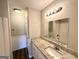 Bathroom featuring a granite countertop vanity and a large mirror at 173 Regency Park Dr, Mcdonough, GA 30253