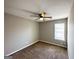 Bedroom featuring neutral paint, ceiling fan, brown carpet and natural light from window at 173 Regency Park Dr, Mcdonough, GA 30253