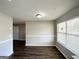 Dining area featuring fresh paint, a large window, and hardwood floors at 173 Regency Park Dr, Mcdonough, GA 30253