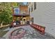 Multi-level deck and patio with an outdoor kitchen and a brick fire pit at 1721 Telfair Chase Way, Lawrenceville, GA 30043