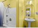 Full bathroom with shower and pedestal sink at 1721 Telfair Chase Way, Lawrenceville, GA 30043