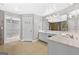 Spacious primary bathroom has double sinks, tile floor and leads to the walk-in closet at 1721 Telfair Chase Way, Lawrenceville, GA 30043