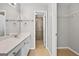 Bright bathroom with large vanity, framed mirror and tiled shower at 1721 Telfair Chase Way, Lawrenceville, GA 30043