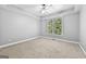 Neutral bedroom with carpeting and lots of light at 1721 Telfair Chase Way, Lawrenceville, GA 30043