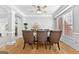 Dining room with hardwood floors, a table setting, and an open layout for entertaining guests at 1721 Telfair Chase Way, Lawrenceville, GA 30043