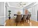 Elegant dining room with hardwood floors, tray ceiling, and large window for natural light at 1721 Telfair Chase Way, Lawrenceville, GA 30043