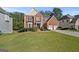 Lovely two-story brick home with lush green lawn and a two-car garage at 1721 Telfair Chase Way, Lawrenceville, GA 30043