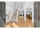 Spacious foyer with hardwood floors, staircase, columns, and an open layout for welcoming appeal at 1721 Telfair Chase Way, Lawrenceville, GA 30043
