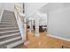 Bright foyer features hardwood floors, staircase, and open layout with view into living spaces at 1721 Telfair Chase Way, Lawrenceville, GA 30043