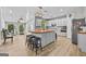 Bright eat-in kitchen with an island, stainless appliances, and breakfast bar at 1721 Telfair Chase Way, Lawrenceville, GA 30043