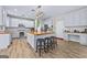 Bright eat-in kitchen features an island, stainless appliances, and breakfast bar at 1721 Telfair Chase Way, Lawrenceville, GA 30043