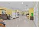Open-concept living space with tile flooring and plenty of natural light at 1721 Telfair Chase Way, Lawrenceville, GA 30043