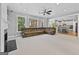 This open living room features large windows and access to the kitchen at 1721 Telfair Chase Way, Lawrenceville, GA 30043