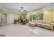 Bright living area with tile flooring, comfortable seating, and outdoor views at 1721 Telfair Chase Way, Lawrenceville, GA 30043