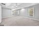 Spacious main bedroom with large windows and neutral carpet at 1721 Telfair Chase Way, Lawrenceville, GA 30043