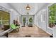 Sunroom with fitness equipment and access to the porch at 1721 Telfair Chase Way, Lawrenceville, GA 30043