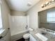 Well-lit bathroom with granite countertop, large mirror, and shower with tub at 371 Coral Cir, Mcdonough, GA 30253