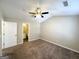 Carpeted bedroom features neutral walls and ceiling fan at 371 Coral Cir, Mcdonough, GA 30253
