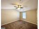 Carpeted bedroom featuring neutral walls and ceiling fan at 371 Coral Cir, Mcdonough, GA 30253