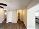 This open living room has hard surface flooring, stairs, and leads to the kitchen at 371 Coral Cir, Mcdonough, GA 30253