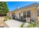 Outdoor patio featuring a seating area, plants, and a view of the backyard at 2636 General Lee Ct, Buford, GA 30519