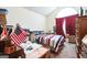 Bedroom with vaulted ceiling, dormer window, and ample space for furniture at 2636 General Lee Ct, Buford, GA 30519