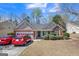 Charming single-story brick home with a two-car garage and well-maintained front yard at 2636 General Lee Ct, Buford, GA 30519