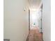Hallway with neutral walls, carpet, and multiple doorways at 2636 General Lee Ct, Buford, GA 30519