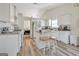 Bright kitchen with granite counters, island with seating, and stainless steel appliances at 2636 General Lee Ct, Buford, GA 30519