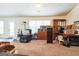 Inviting living room with carpet flooring, a window, and a door to the outside at 2636 General Lee Ct, Buford, GA 30519