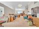 Bright living area featuring neutral walls, carpet flooring, and ample space to relax and entertain at 2636 General Lee Ct, Buford, GA 30519
