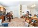 Large living room with a fireplace, carpet, and a door leading to other rooms at 2636 General Lee Ct, Buford, GA 30519