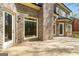 Back of a brick house with an attached wooden deck, perfect for outdoor gatherings at 5265 Brookhollow Dr, Douglasville, GA 30135