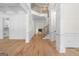 Bright, spacious foyer with hardwood floors, white trim, staircase, and fireplace in view at 5265 Brookhollow Dr, Douglasville, GA 30135