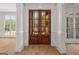 Grand double front doors framed by white columns and large windows showing wooded outdoor scene at 5265 Brookhollow Dr, Douglasville, GA 30135