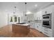 Spacious kitchen boasts an island cooktop, stainless appliances, and adjoins a sunlit breakfast nook at 5265 Brookhollow Dr, Douglasville, GA 30135