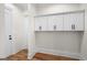 Mudroom with built-in cabinets and oak flooring is perfect for organizing your gear at 5265 Brookhollow Dr, Douglasville, GA 30135