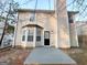 Rear exterior of home featuring a gray patio, light siding, and a chimney at 2940 Highland Hill Pkwy, Douglasville, GA 30135