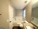 Neutral bathroom with a white bathtub and vanity at 2940 Highland Hill Pkwy, Douglasville, GA 30135