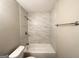 Bathroom with white tiled shower and vanity at 2940 Highland Hill Pkwy, Douglasville, GA 30135