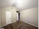 Bedroom featuring neutral walls and brown carpet and doors leading to other rooms at 2940 Highland Hill Pkwy, Douglasville, GA 30135