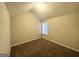 Bedroom featuring neutral walls and brown carpet, and natural light from the window at 2940 Highland Hill Pkwy, Douglasville, GA 30135