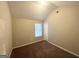 Bedroom with neutral walls, brown carpet, and a window with blinds at 2940 Highland Hill Pkwy, Douglasville, GA 30135