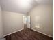 Bedroom with neutral walls, brown carpet, and a view of the stairs at 2940 Highland Hill Pkwy, Douglasville, GA 30135