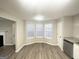 Dining area with hardwood floors, large windows, and access to the kitchen at 2940 Highland Hill Pkwy, Douglasville, GA 30135