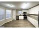 Modern kitchen with stainless steel appliances, granite countertops, and ample cabinet space at 2940 Highland Hill Pkwy, Douglasville, GA 30135