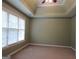 Spacious bedroom with neutral carpet, a ceiling fan, and natural light from the windows at 5860 Fairway View Dr, Suwanee, GA 30024