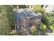 Aerial view of a brick home with a mature tree canopy at 619 E Pelham Ne Rd, Atlanta, GA 30324