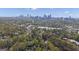 Stunning aerial view of a green neighborhood and the Atlanta skyline at 619 E Pelham Ne Rd, Atlanta, GA 30324